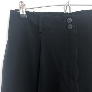 Black pleated trousers